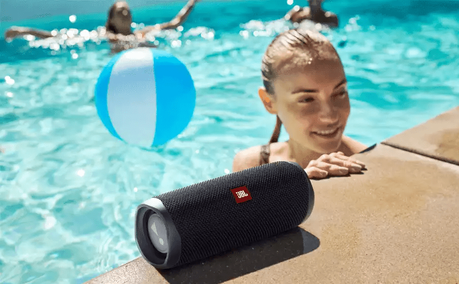  Product image for a portable Bluetooth speaker from JBL, shown in real-life situations, helping users visualize its size and use cases